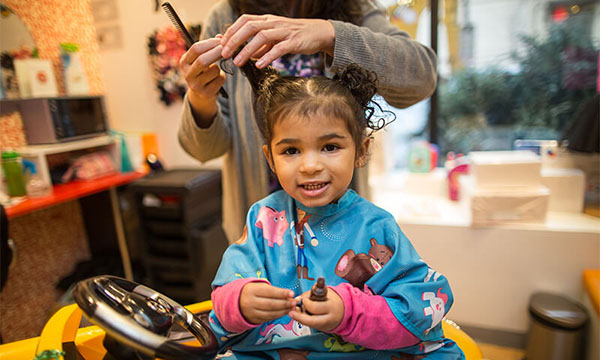 curly haired girl stylist salon non featured