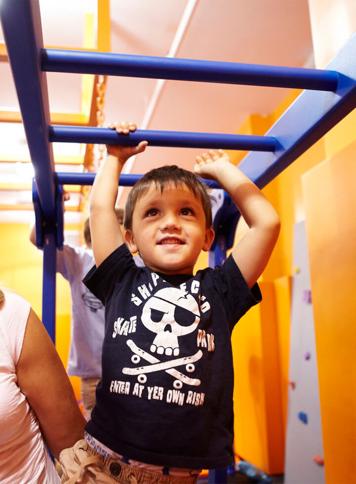 monkey bars smiling boy weird crop