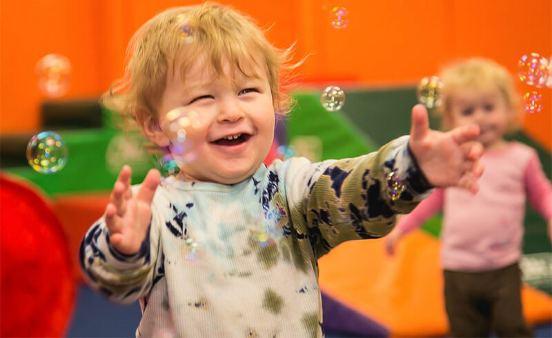 gym smiling boy bubbles featured class card