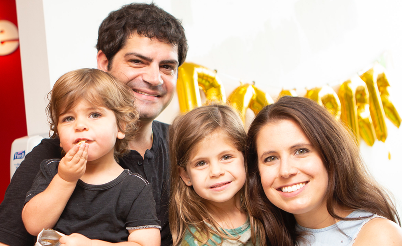 family smiling at party