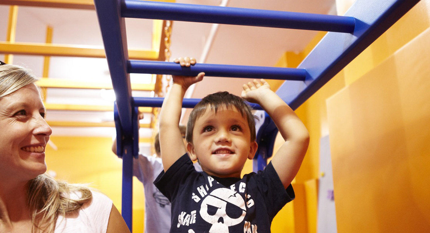 monkey bars smiling boy full width