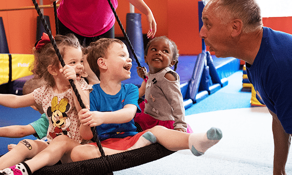 Kids on Swing in Gym with Teacher_non featured-min