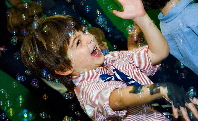 boy-laughing-party-bubbles-featured