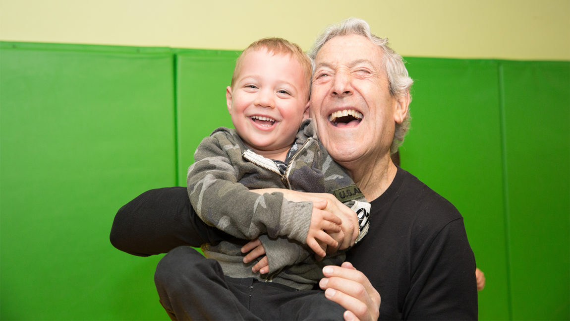 laughing grandpa and child cta full width