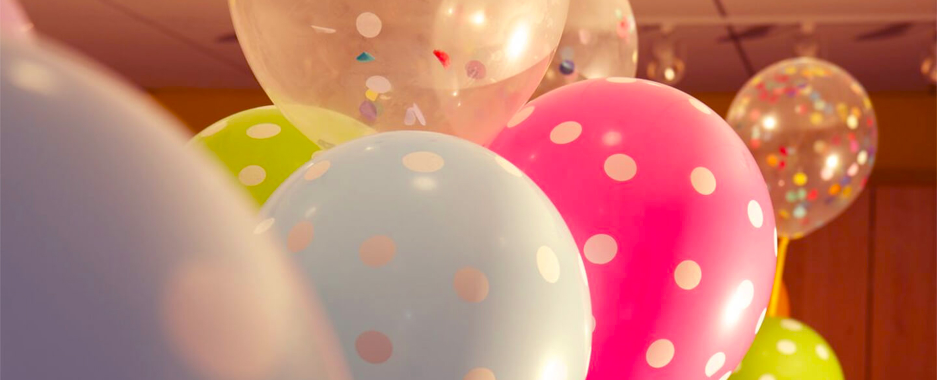 balloons close up confetti polka dots full width